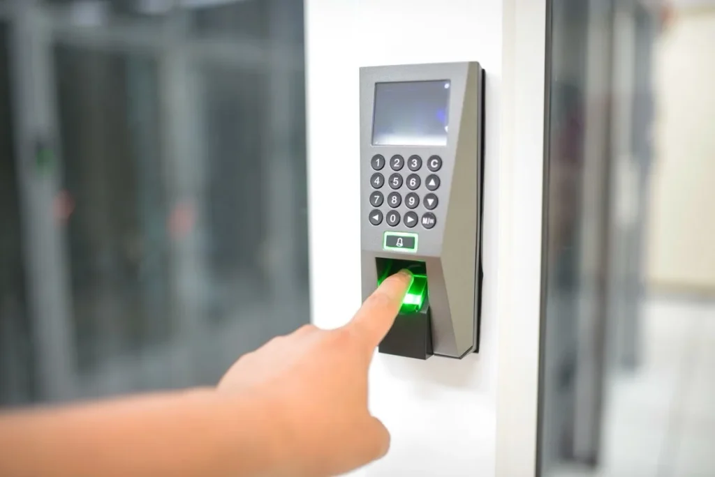 Person using a secure access control scanner to enter a business area