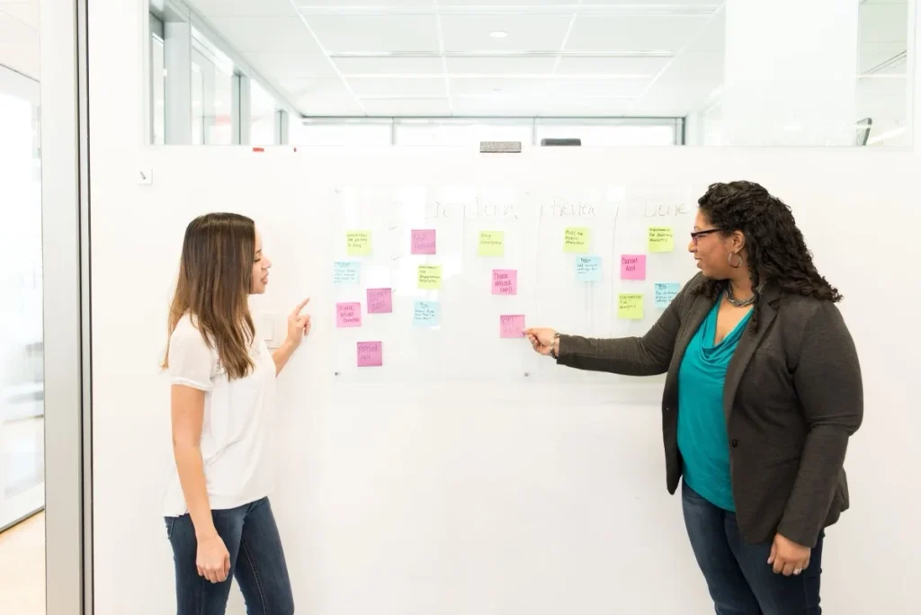 Two team members reviewing a task before it is approved for development